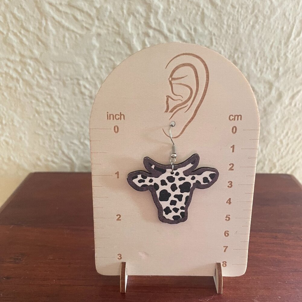 Bundle 3 for $12. Wooden bull dangle earrings